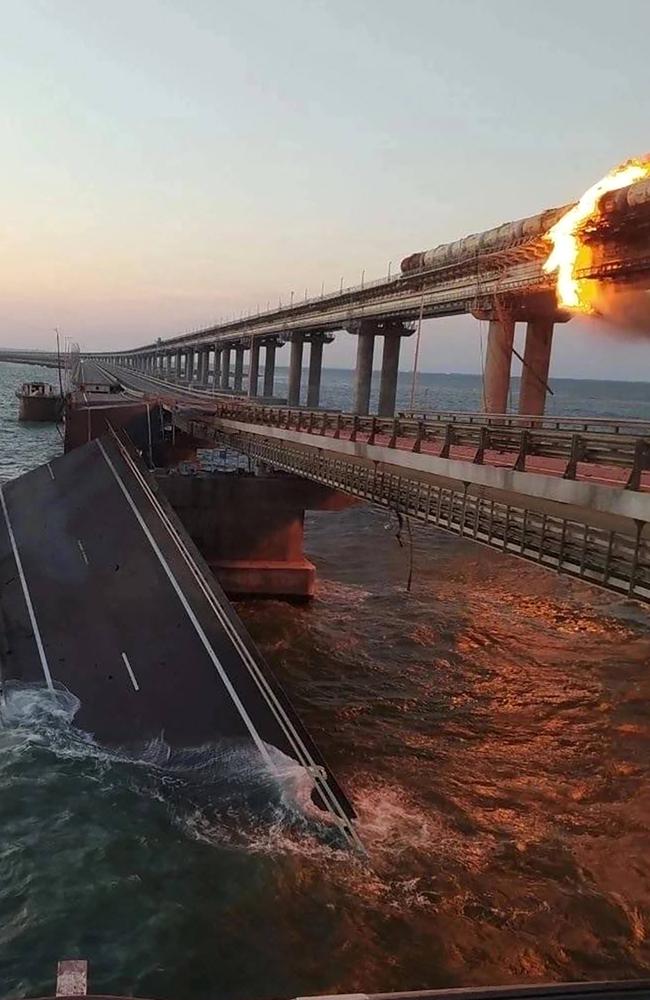 A fire sparked by a car bomb that on a key bridge linking Crimea to Russia, near Kerch, on October 8, 2022.