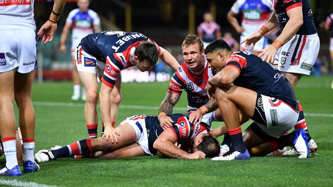 Teammates rush to Boyd Cordner’s aid. Picture: Gregg Porteous/NRL