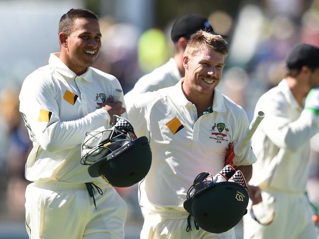 Australian batsmen Usman Khawaja (left) and David Warner smile as they walk from the field at tea on day 1 of the second Trans-Tasman Test match between Australia and New Zealand at the WACA ground in Perth , Friday, Nov. 13, 2015. (AAP Image/Dave Hunt) NO ARCHIVING, EDITORIAL USE ONLY, IMAGES TO BE USED FOR NEWS REPORTING PURPOSES ONLY, NO COMMERCIAL USE WHATSOEVER, NO USE IN BOOKS WITHOUT PRIOR WRITTEN CONSENT FROM AAP
