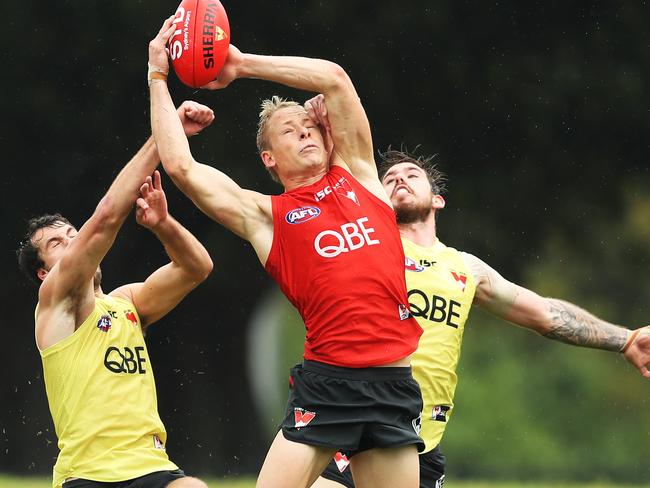 Isaac Heeney takes a big grab at Swans training.