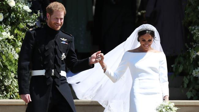 Harry and Meghan on the steps of St George’s Chapel, where Eugenie and Jack will also exit as man and wife in the coming months. Photo: Jane Barlow/WPA Pool/Getty Images