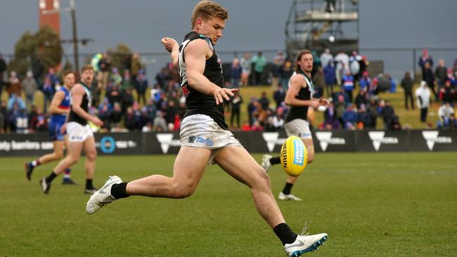 Port Adelaide's Ollie Wines kicks the ball forward against the Western Bulldogs at Mars Stadium in Ballarat.. .Pictutre: Michael Klein