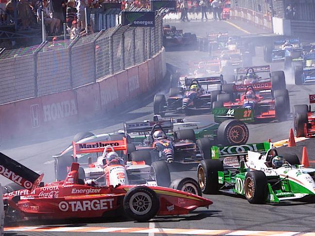 Racing driver Juan Montoya (Target) crashes with Gil de Ferran (Marlboro) during first lap accident. Motor car racing - Honda Gold Coast Indy 300 race 15 Oct 2000.