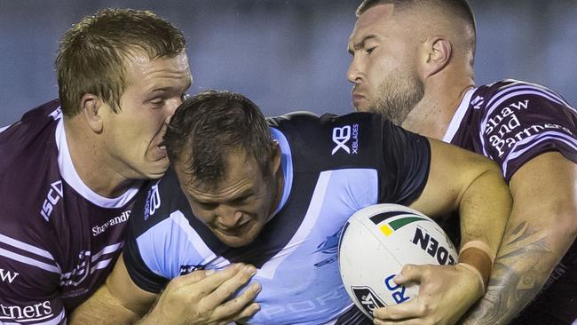 Josh Morris charges through the Manly pack (AAP Image/Craig Golding)