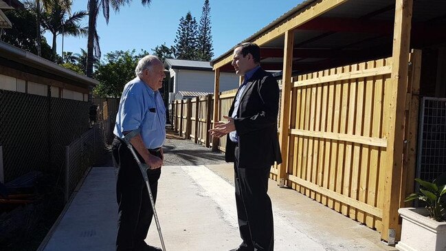 Cr Jon Raven speaks with a resident of a dual-occupancy property in Division 5.