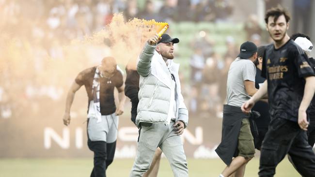 Lunatic supporters bring the game to a standstill with scenes which will travel around the world. Picture: Darrian Traynor/Getty Images