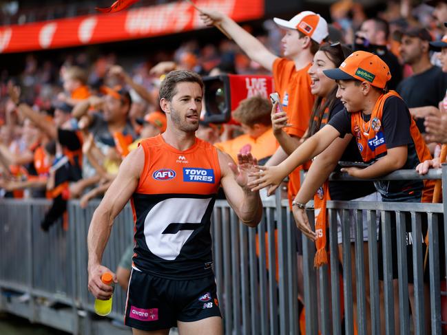 Callan Ward celebrates a win with fans. Picture: Dylan Burns/AFL Photos via Getty Images.