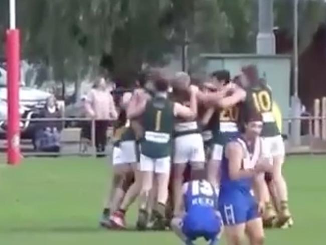 Travis McIntyre is mobbed as Salisbury North celebrates his winning goal. Source: Filming Footy