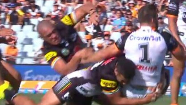 Viliame Kikau smashes James Tedesco.