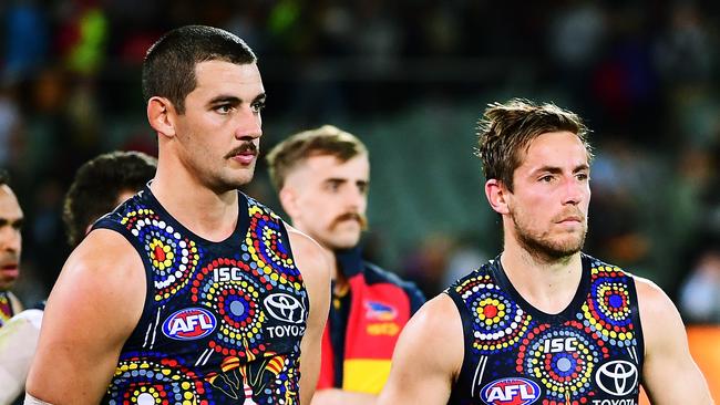 Taylor Walker of the Adelaide Crows and Richard Douglas of the Crows after the Showdown 47 loss. Picture: Mark Brake/Getty Images