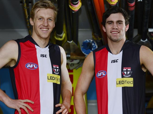 St Kilda draftees Hugh Goddard and Paddy McCartin show off their new jumpers at the Kurrawa Beach Surf Life Saving Club on the Gold Coast