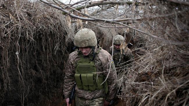 Servicemen of Ukrainian Military Forces keep position on the front line with Russia backed separatists, near Novolugansk, in the Donetsk region. Picture: AFP