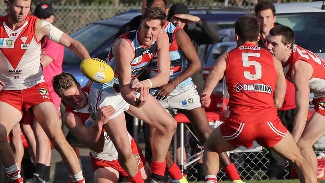 TSL: Lauderdale vs Clarence, Lauderdale Oval: Lauderdale's Josh McGuinness looks to offload the ball. Picture: LUKE BOWDEN