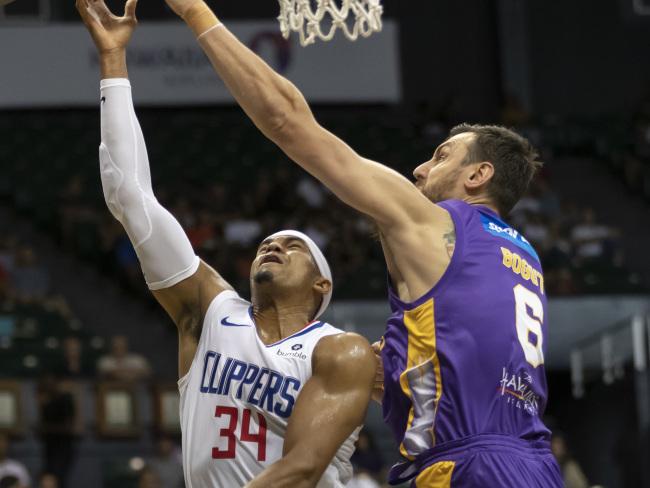 Los Angeles Clippers forward Tobias Harris (34) has his shot blocked by Sydney Kings centre Andrew Bogut (6). Picture: AP Photo