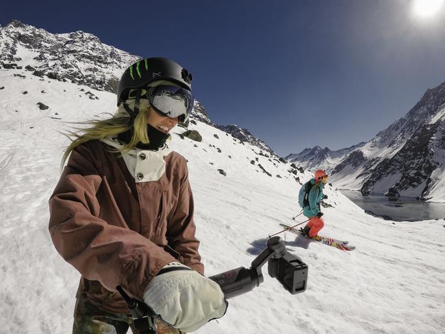 A skier films herself with GoPro Karma.