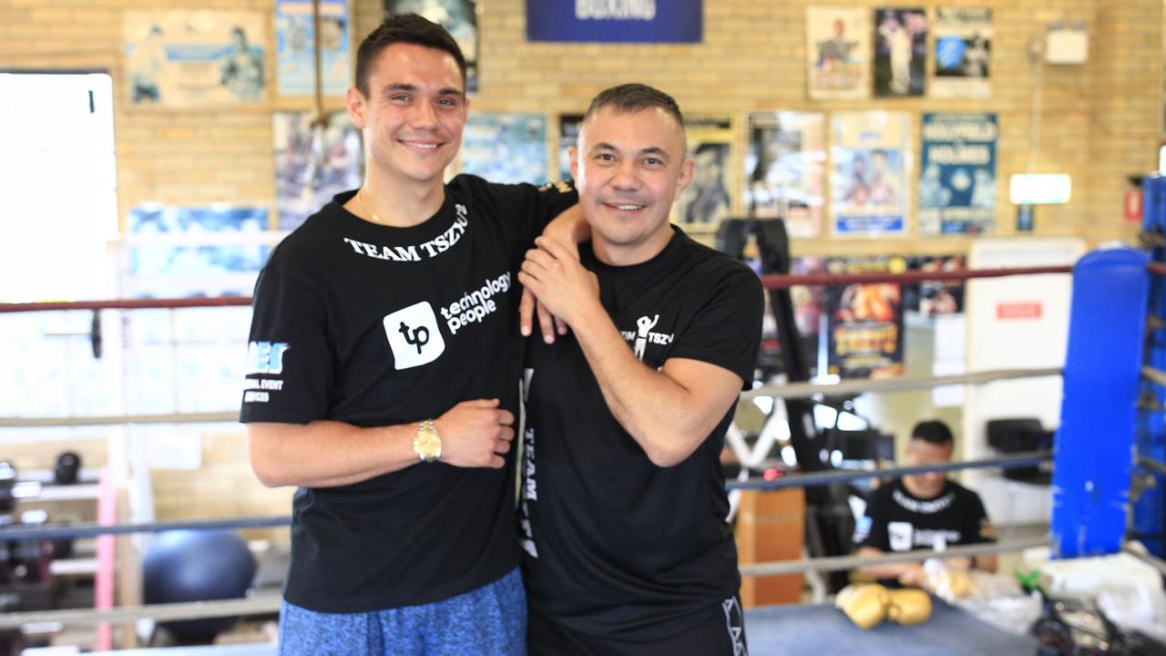 Tim and Kostya Tszyu at their family gym with old fight posters in the background. (Photo by Mark Evans/Getty Images)