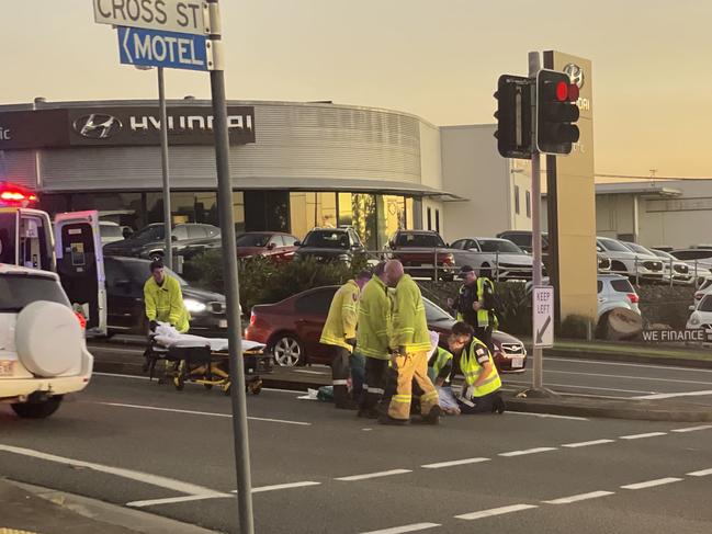 Pedestrian hit by car at busy intersection