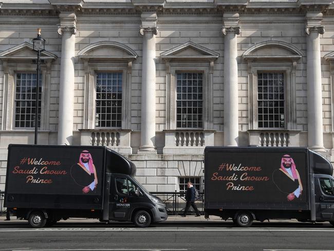 Vans featuring a welcome to the Crown Prince of Saudi Arabia, Mohammad bin Salman are parked in Whitehall in central London. Picture: AFP PHOTO / Daniel LEAL-OLIVAS