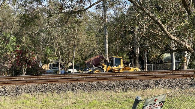 The excavator beside the rail tracks at Dinmore. Picture: Jessica Baker