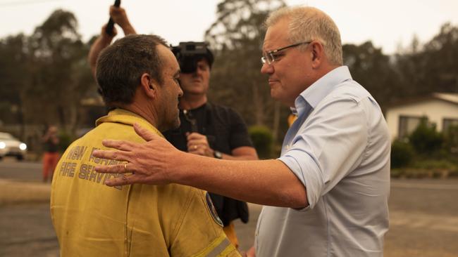 Prime Minister Scott Morrison meets Mark Ayliffe at the Cobargo RFS station in NSW. Picture: Sean Davey