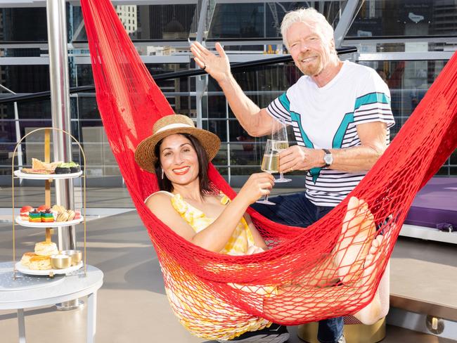 ***EMBARGOED UNTIL 12TH DECEMBER 2023***, Sir Richard Branson, chairman of the Virgin Group with school teacher Nicole Katrib on board a Virgin Voyages ship Resilient Lady. Photographer: Scott Elher