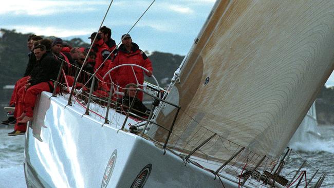 Sydney to Hobart Yacht Race 60 Years, 1998 line honours winner Sayonara with skipper Larry Ellison at the helm heads for the finish line just after dawn, Picture Leigh Winburn, Proof 4, AD9311/18