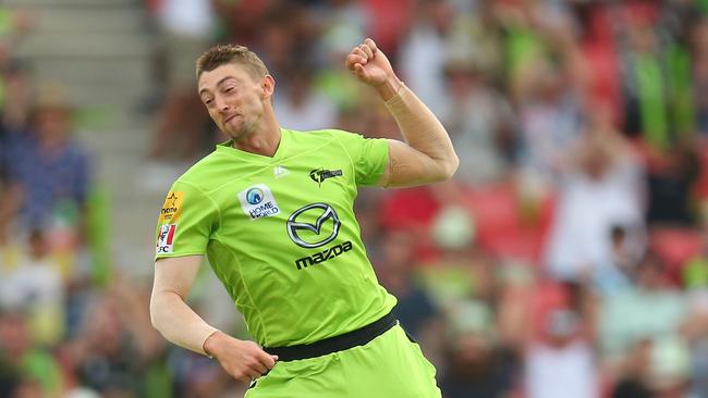 Daniel Sams jumps for joy after snaring a wicket for Sydney Thunder.