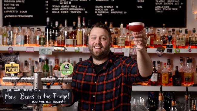 Small bar owner Michael West celebrates the imminent easing of restrictions with a cocktail at Mississippi Moon on Gresham St in the city. Picture: Naomi Jellicoe