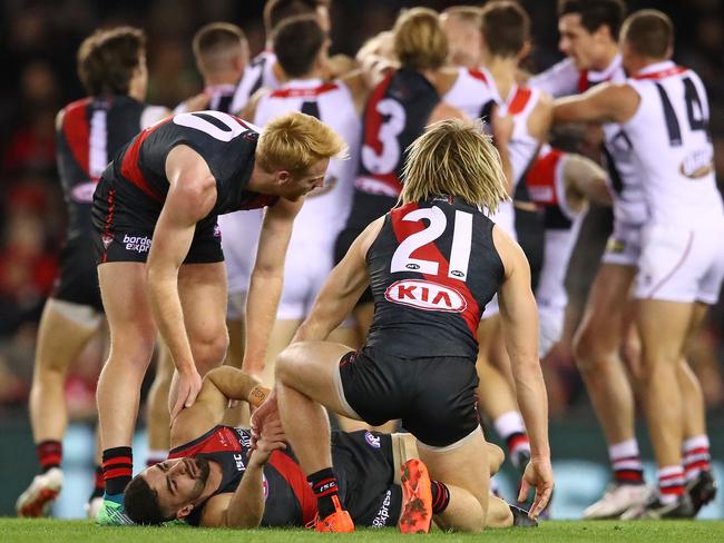 Essendon players remonstrate with Nathan Brown after Adam Saad was knocked out. Picture: Getty Images