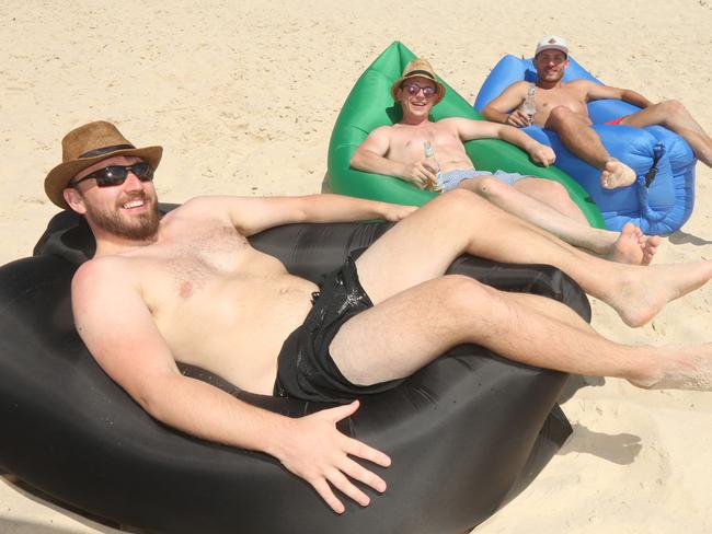 People enjoying Australia day at the Currumbin Beach.L-R Dave McQueen, Matthew Cottoril, and Ashley Shore. Picture Mike Batterham