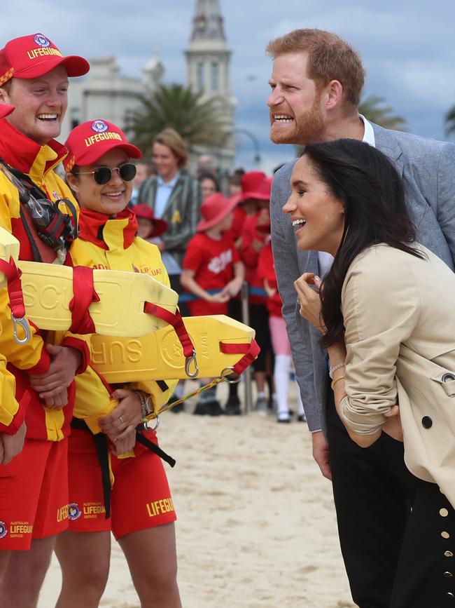 Harry and Meghan chat to lifesavers on South Melbourne Beach. Picture: Alex Coppel