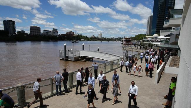 January 2013: Brisbane River peaking around Eagle Street Pier. Picture: Pete Wallis