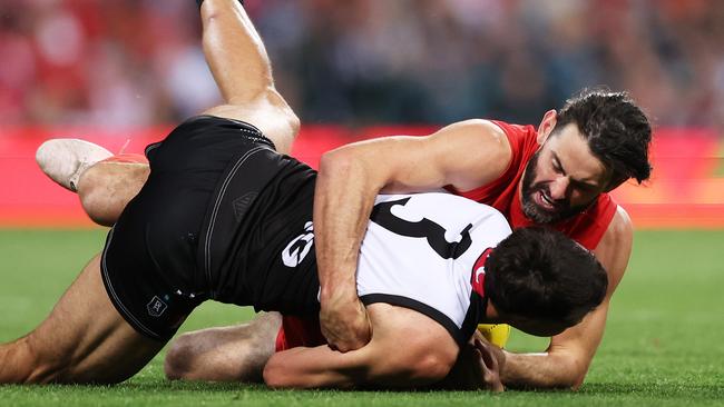 SYDNEY, AUSTRALIA - SEPTEMBER 20:  Ryan Burton of the Power is tackled by Brodie Grundy of the Swans during the AFL Preliminary Final match between Sydney Swans and Port Adelaide Power at Sydney Cricket Ground, on September 20, 2024, in Sydney, Australia. (Photo by Matt King/AFL Photos/Getty Images)