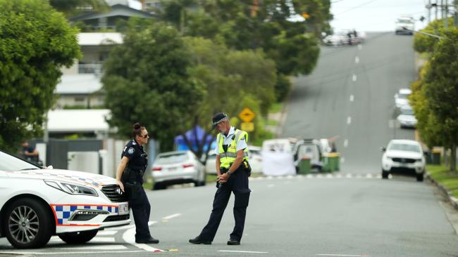 Police at the scene on White St in Labrador. Picture: Nigel Hallett.