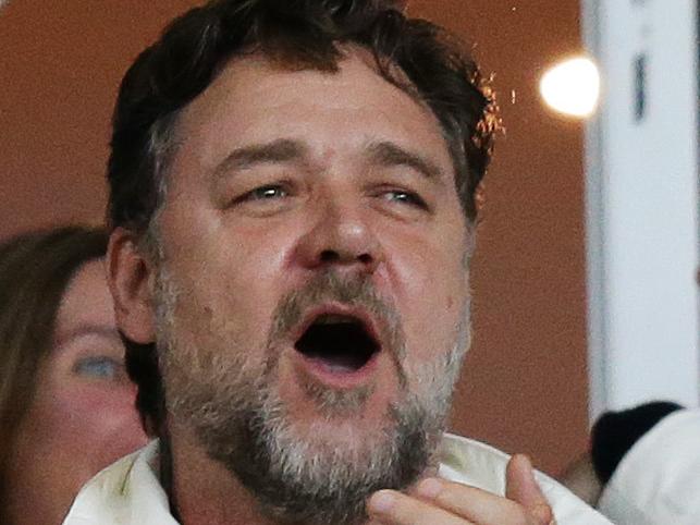Russell Crowe celebrates a try by South Sydney's Lote Tuqiri during the Manly v South Sydney rugby league Second Qualifying Final at Allianz Stadium, Sydney. Pic Brett Costello