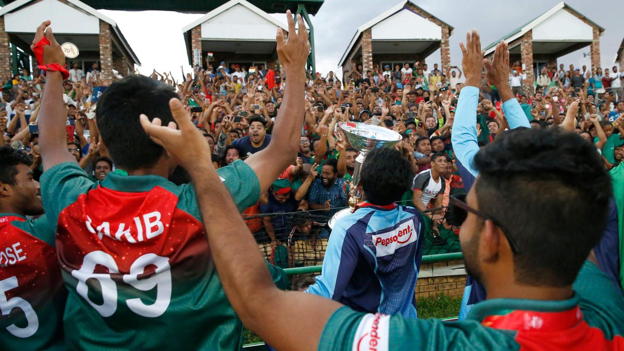 The Bangladesh players celebrate with their fans.
