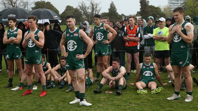 Greensborough players dejected after their grand final loss. Picture: Hamish Blair