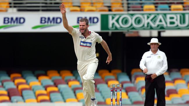 Qld's Chris Swan takes the wicket of WA's Marcus North after he was caught behind by Chris Hartley