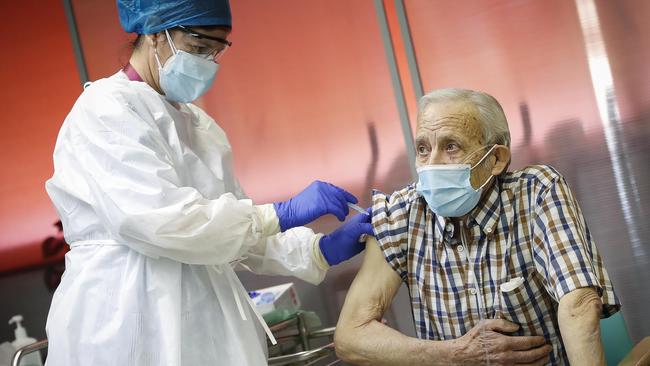 Nicanor, aged 72, receives one of Spain's first Pfizer/BioNTech Covid-19 vaccines in the Vallecas Elderly Centre in Madrid, Spain. Picture: Getty Images