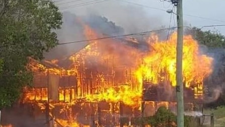 Fire ravages a house in Wynnum this afternoon, forcing nearby homes to be evacuated. Picture: Alouise Munro