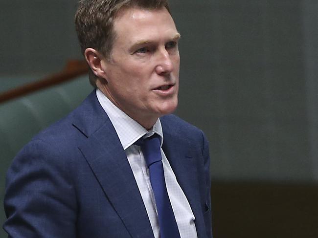 Attorney General Christian Porter, second left, addresses Australian Parliament in Canberra on Thursday, Aug. 1, 2019. Porter said proposed legislation introduced on Thursday would close a loophole that prevents some extremists from being kept in custody. (AP Photo/Rod McGuirk)