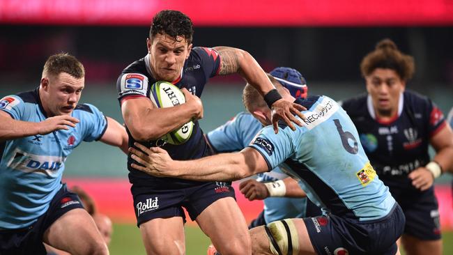 Melbourne Rebels playmaker Matt Toomua takes on the NSW Waratahs defence in the Super Rugby AU game at the SCG. PIcture: AFP