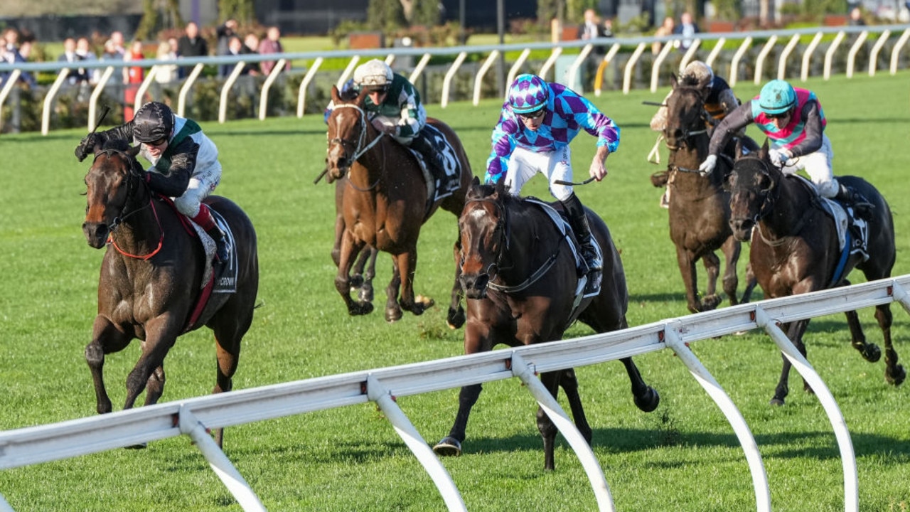 Mr Brightside (black cap) storms home to grab Pride Of Jenni and win the Makybe Diva Stakes at Flemington on Saturday. Photo: George Sal/Getty Images.