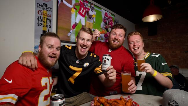 Super Bowl fans Cameron Glowik (Kansas City top), Luke Weddell (Pittsburgh top), Luke Haig-Moir (Tampa Bay top) and Chris Crichton (Green Bay top) at Wing It Sports Bar. Picture: Naomi Jellicoe