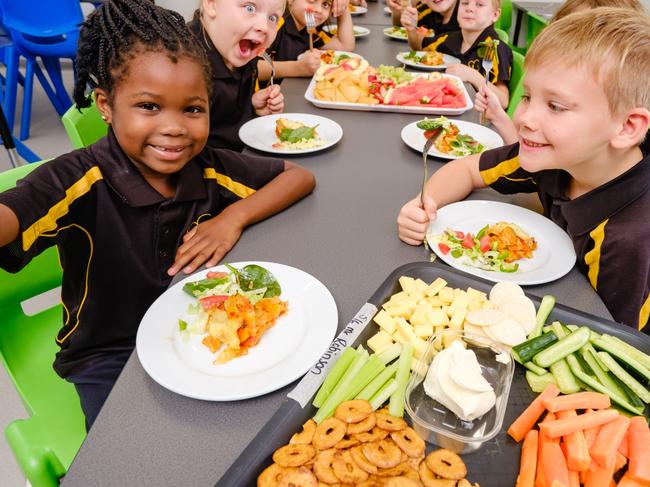 HOLD FOR HERALD SUN.  Mooroopna Park Primary School has been providing 160 students with breakfast, morning and afternoon tea and a hot lunch every day for almost a year, at no cost to families. Lots of community support financially and through food donations. Improving student attendance, engagement and academic results. Jasmine Elnour 6yrs (dark hair) and Oliver Carr-Webb 7yrs. Picture: Simon Dallinger