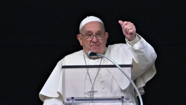 Pope Francis, who is in hospital, gestures to the crowd during the Epiphany Angelus prayer in January. Picture: Andreas Solaro / AFP