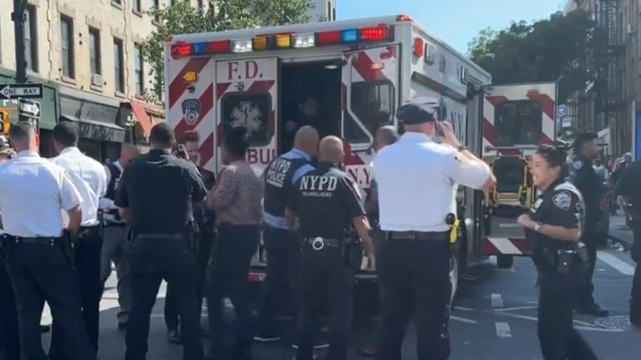 Paramedics tend to a man after the shooting. Picture: CBS News