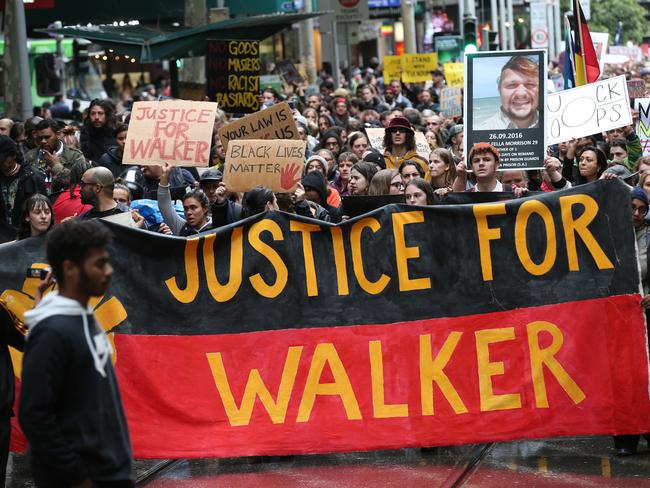 Aboriginal and Torres Strait Islanders communities and allies march during a protest in Melbourne, Wednesday, November 13, 2019. Aboriginal and Torres Strait Islander communities and allies are calling for justice for 19-year-old Warlpiri teenager Kumanjayi Walker, who died after being shot by police on Saturday night in the central desert town of Yuendumu in the Northern Territory. (AAP Image/David Crosling) NO ARCHIVING