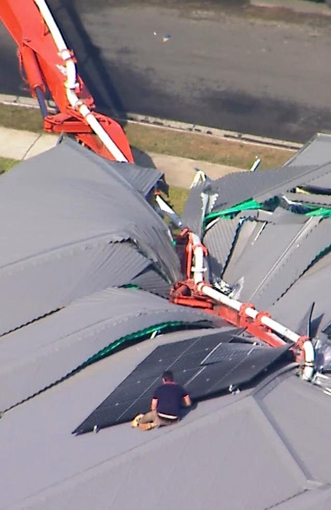 A concrete pumping truck has toppled into home at Deebing Heights, the concrete pour was happening for a property across the road Picture 7News,