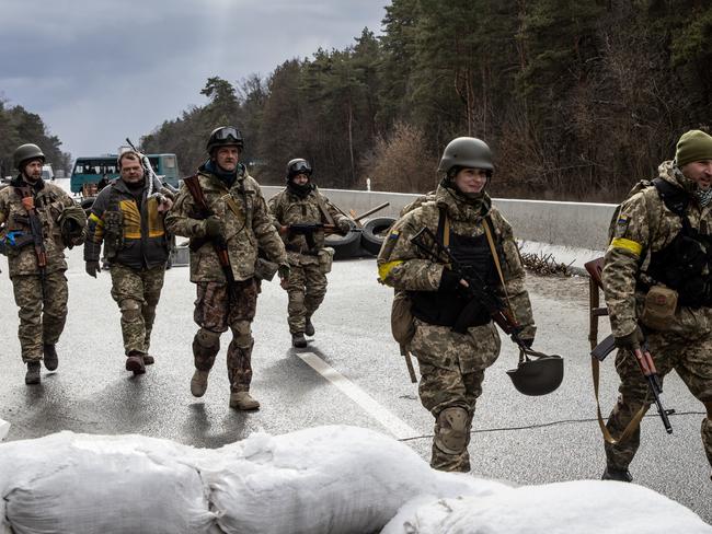 Members of the Ukrainian military arrive to reinforce a forward position on the eastern frontline near Kalynivka village in Kyiv. Picture: Getty Images